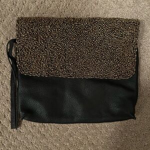 Cleobella black and gold clutch